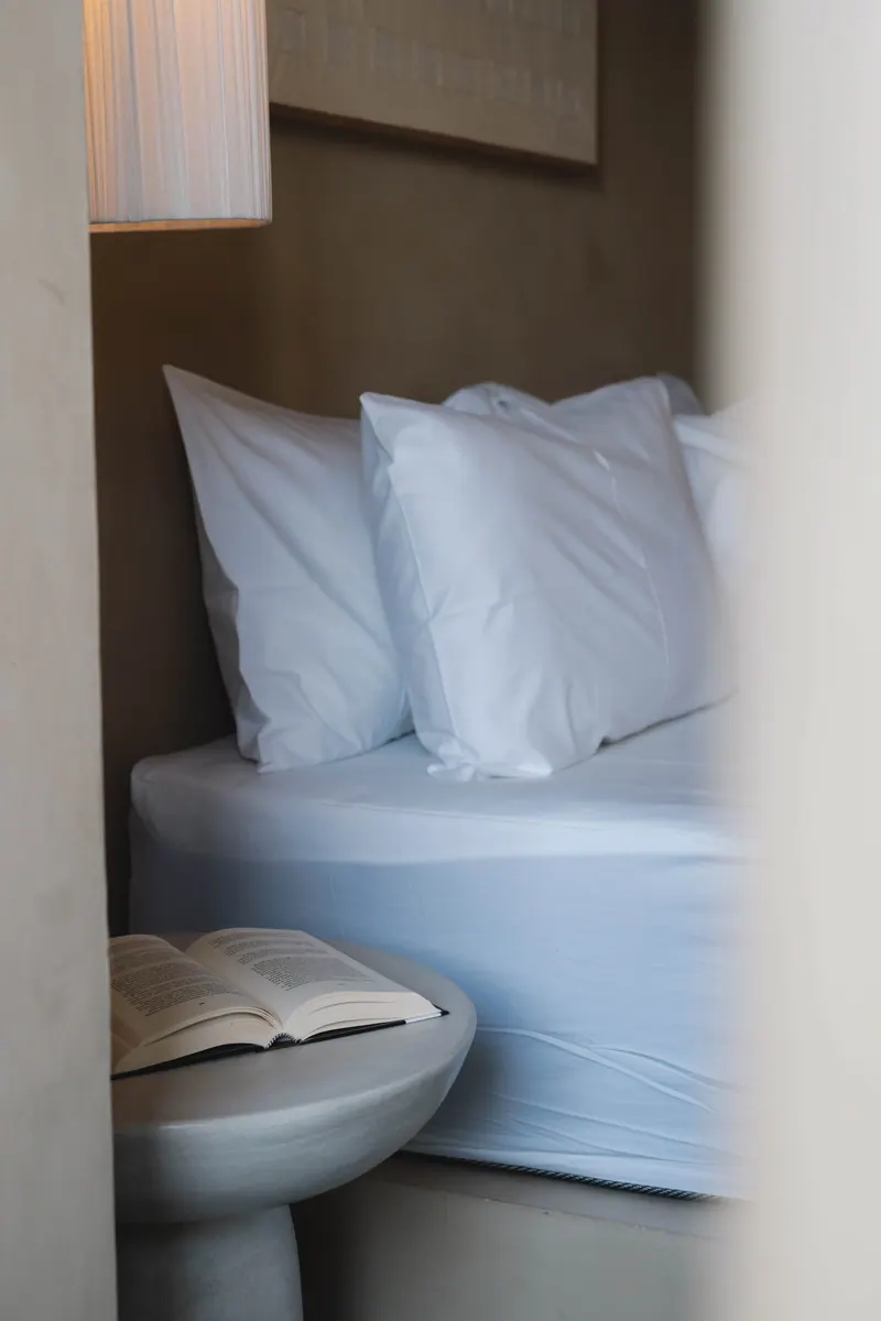 Pillows and linen with a stone side table