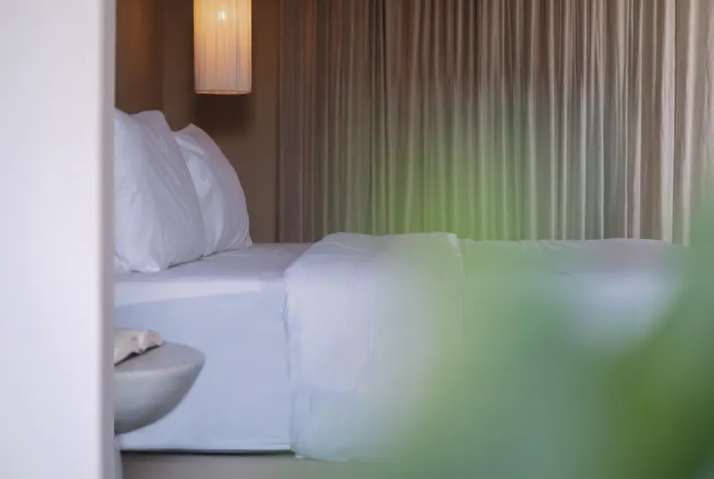 Bed and curtains in soft light